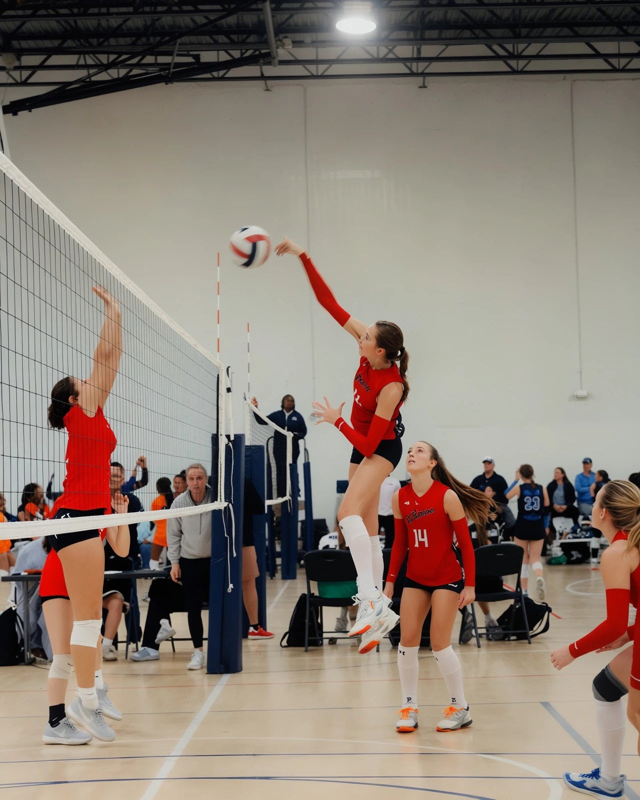 Izzie spiking during a match — photo shared by her mom Cassandra.