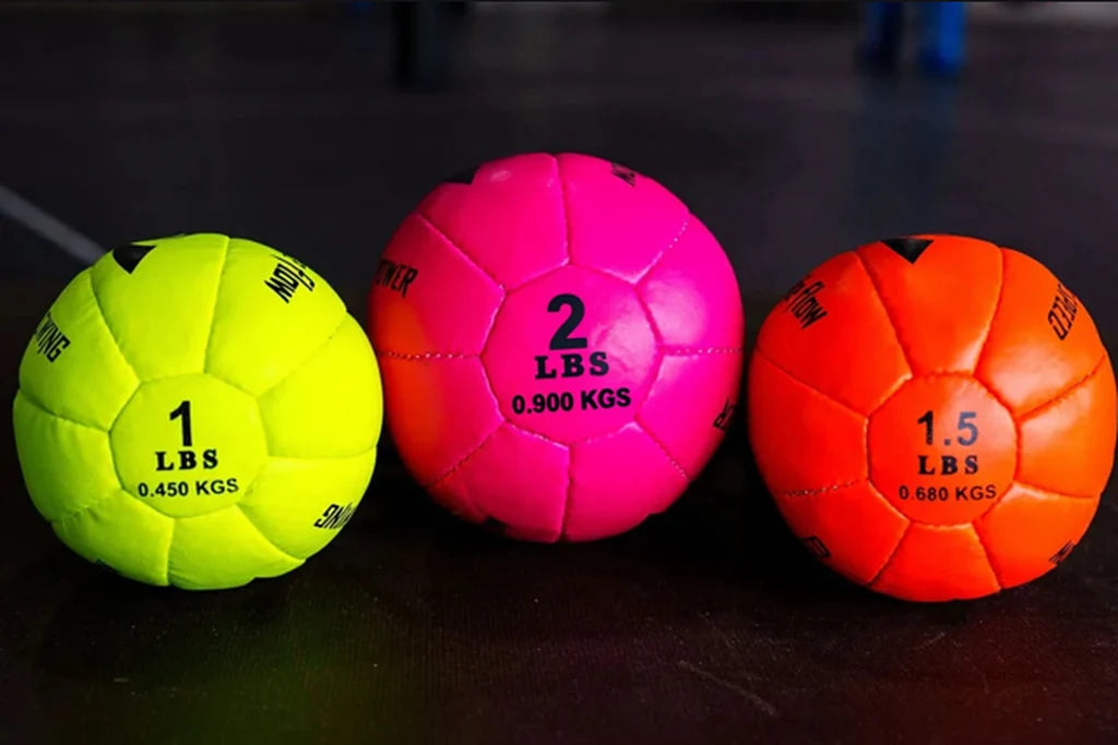The three weighted Pro Spike Flow trainers lined up on the gym floor.